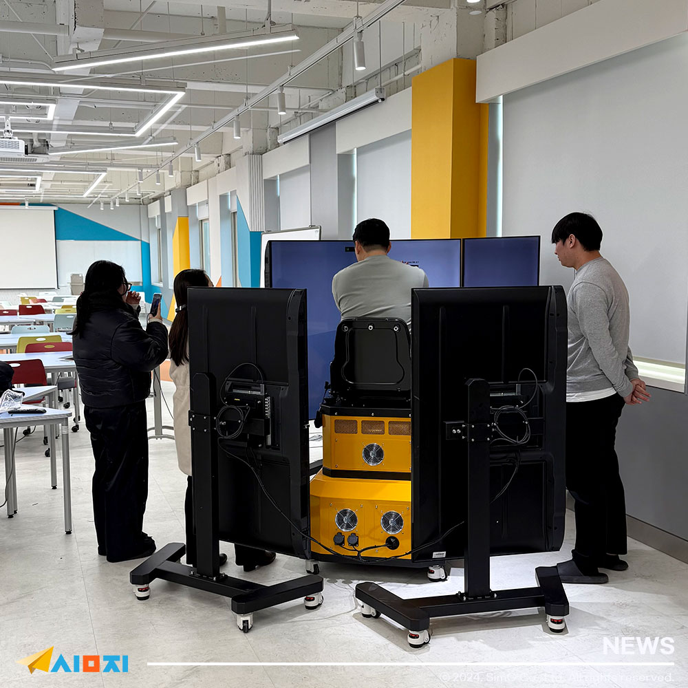 Students demonstrating excavator and forklift simulators during virtual reality training